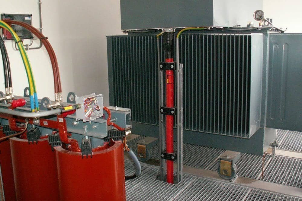 Large power transformer with busbar connections inside an indoor substation room